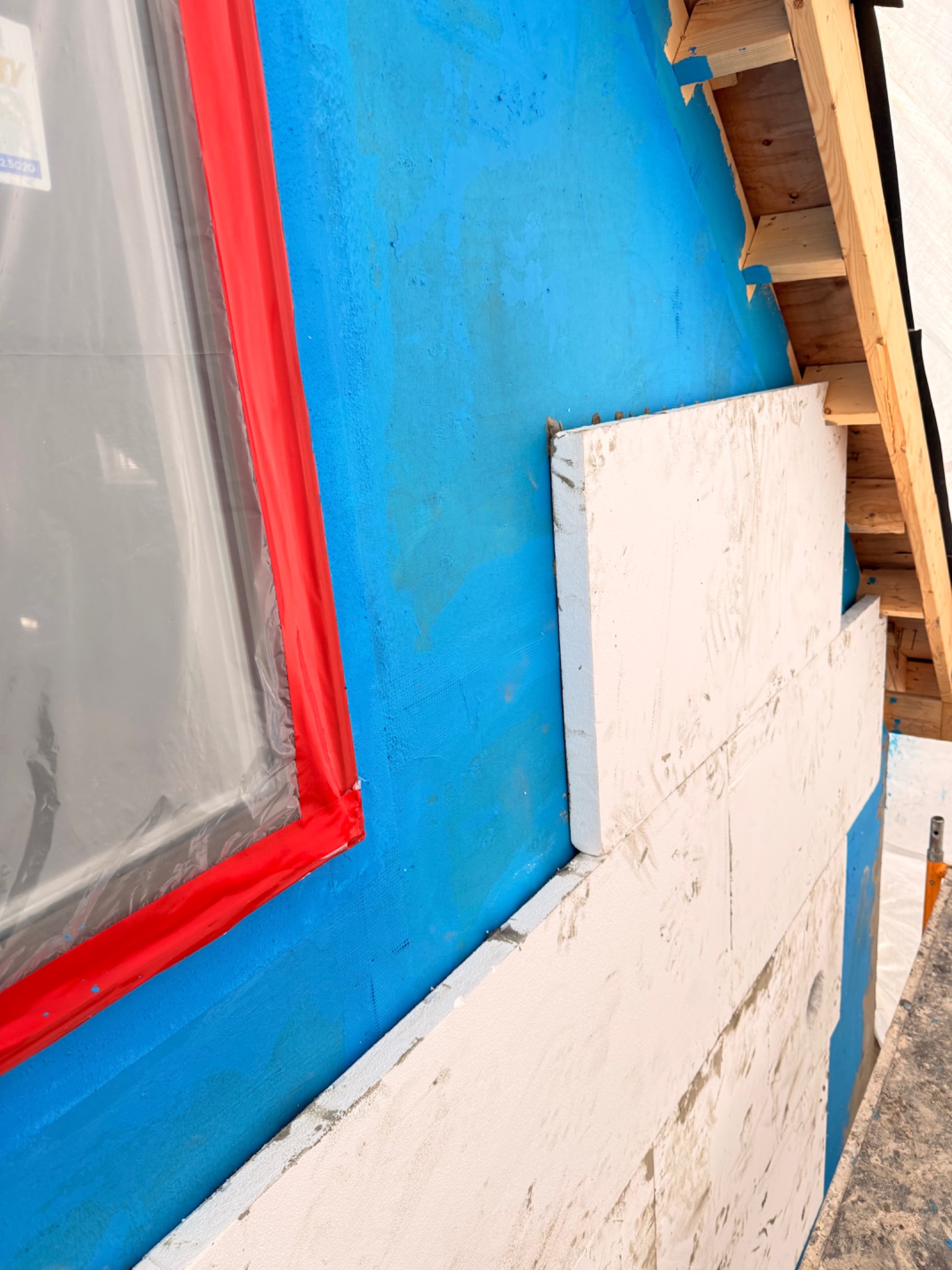 Exterior membrane, sealed window opening, and continuous insulation boards