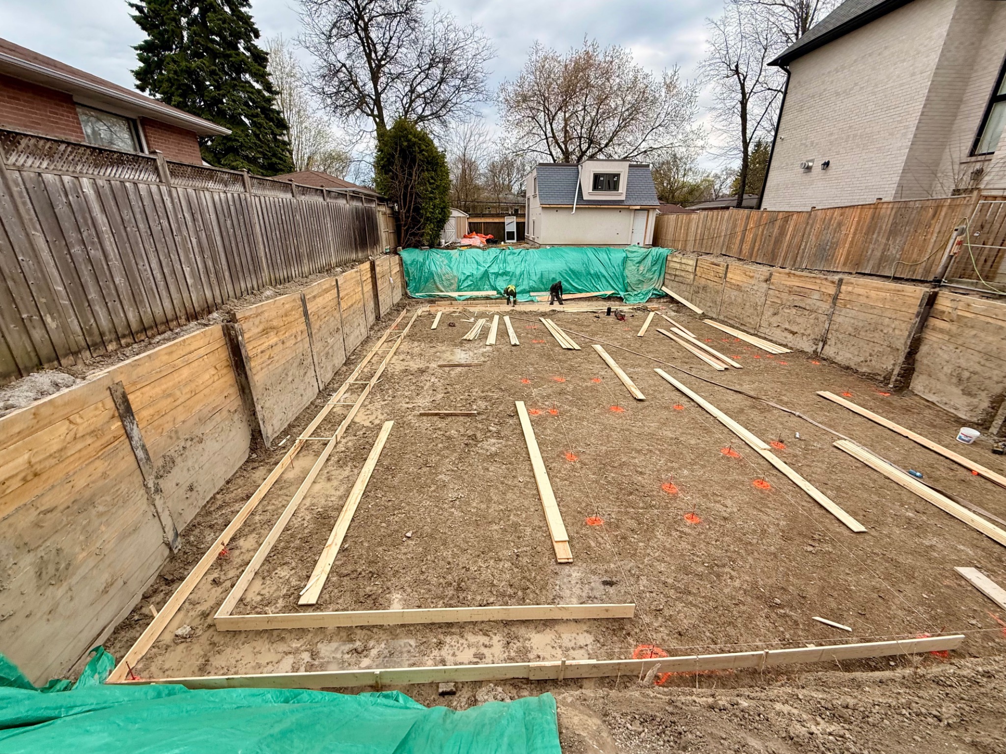 Deep urban excavation retained by engineered perimeter shoring