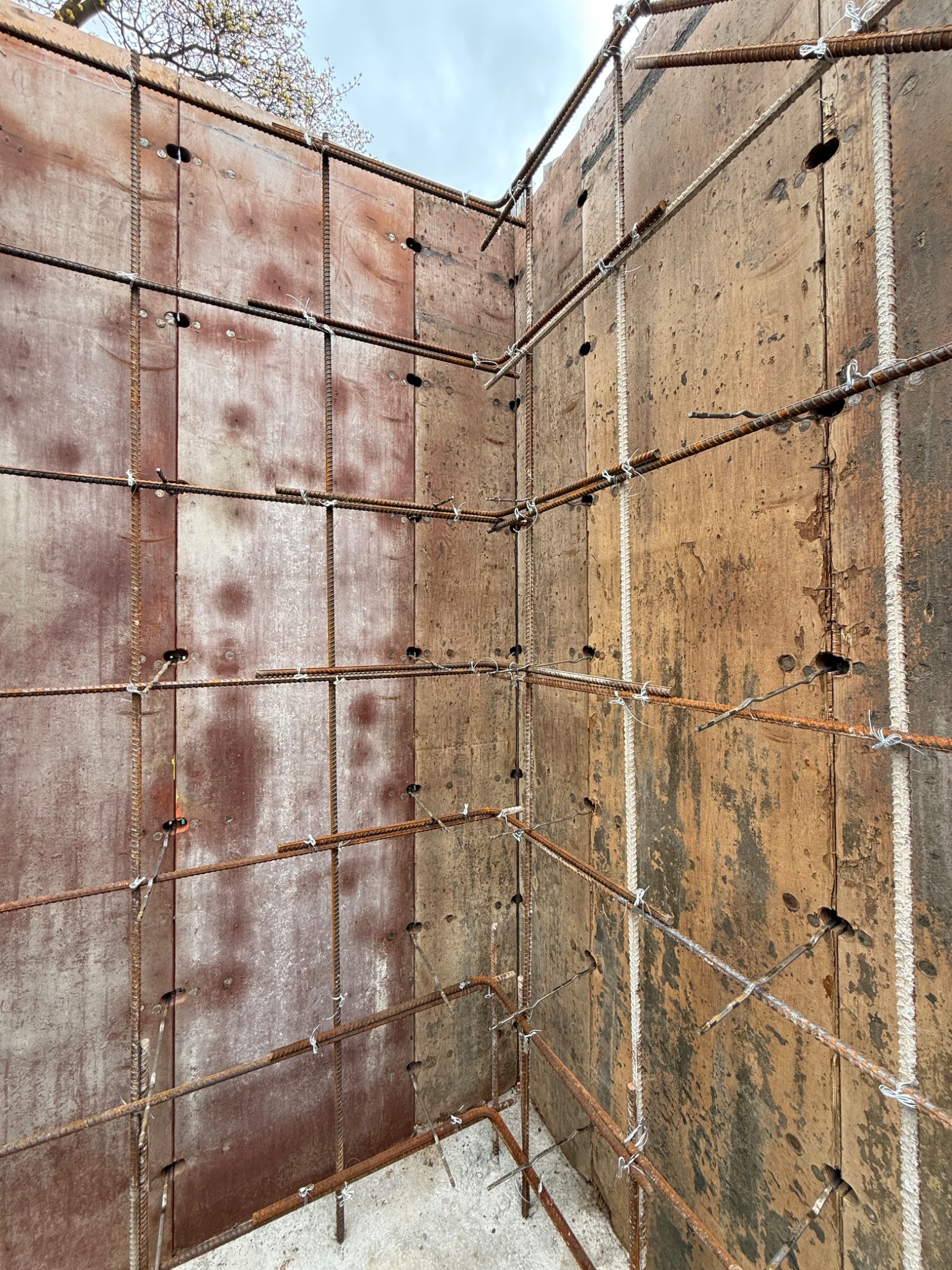 Reinforcing-steel grid within tall foundation wall forms