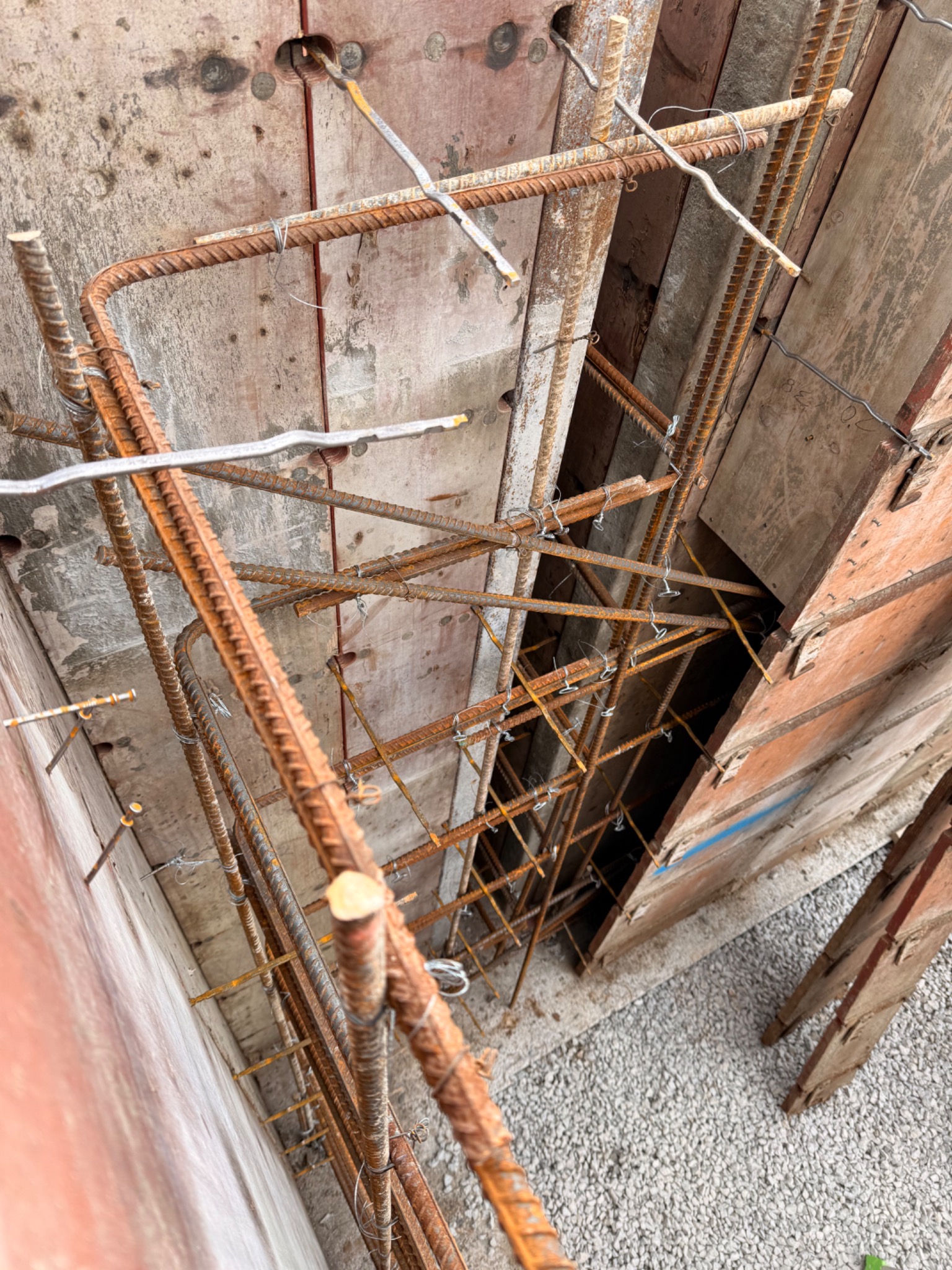 Dense reinforcing-steel layout prepared inside concrete wall forms