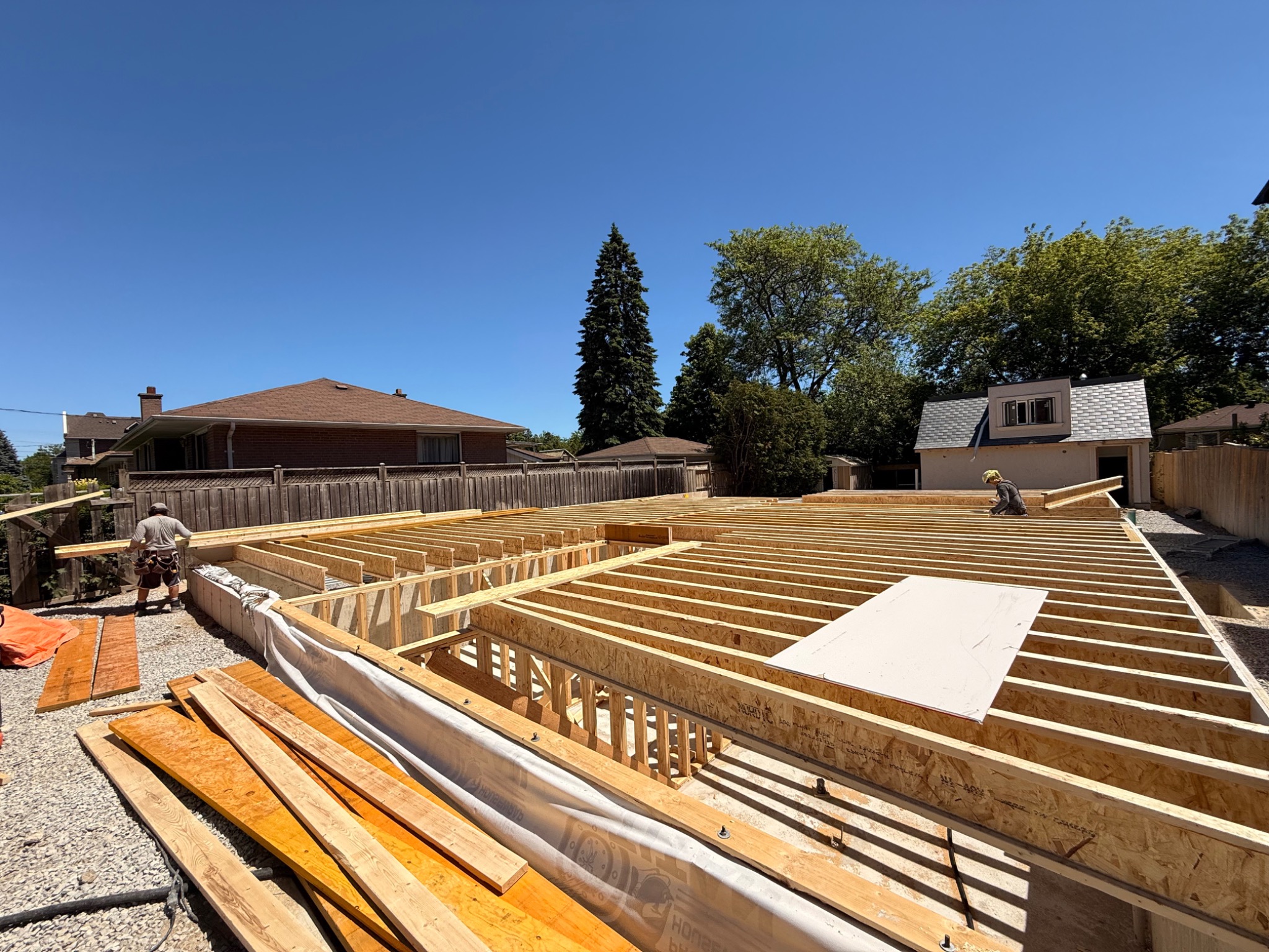 Lower-level and ceiling framing complete on June 8